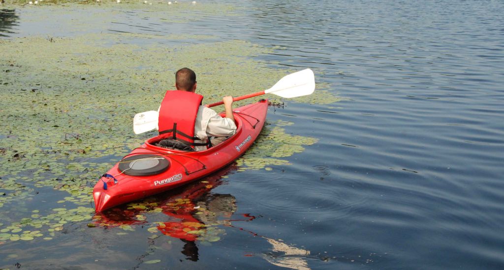 sportist-relaxing-canoe-ride-on-a-quiet-river